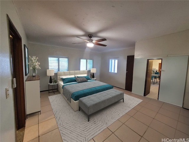 bedroom featuring ceiling fan and light tile patterned floors