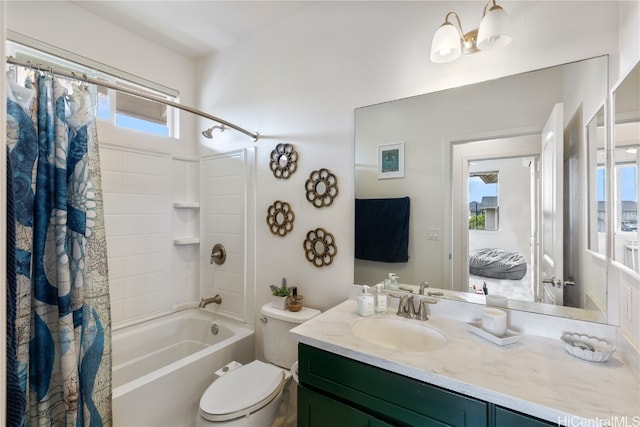 full bathroom with vanity, a healthy amount of sunlight, shower / bath combo, and toilet