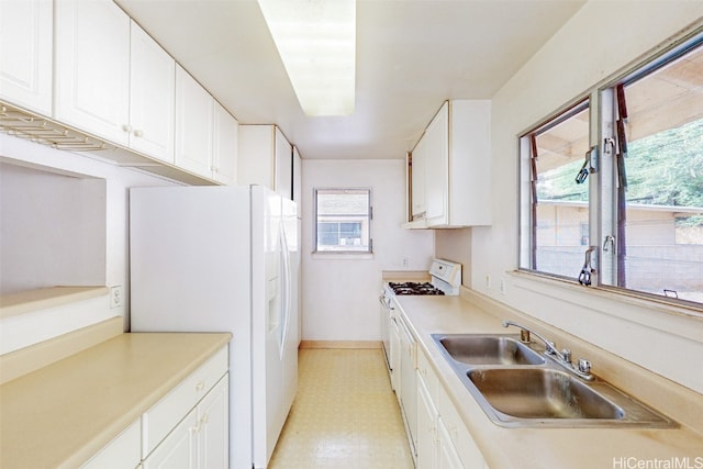 kitchen with white cabinetry and a wealth of natural light