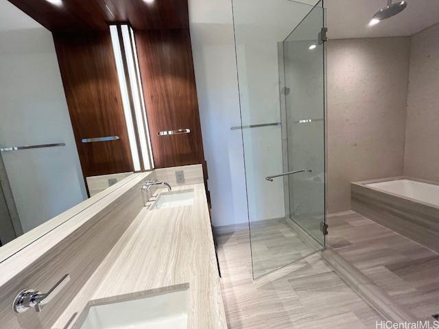 bathroom featuring vanity and a shower with shower door