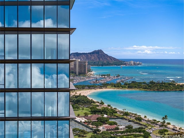 view of water feature with a mountain view and a beach view