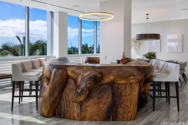 living room featuring a wealth of natural light and hardwood / wood-style floors