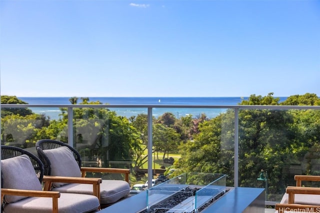 balcony featuring a water view