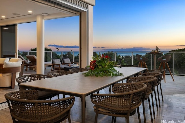 dining space with a wealth of natural light and a water view