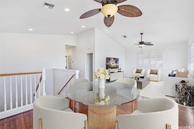 dining area with high vaulted ceiling, dark hardwood / wood-style flooring, and ceiling fan