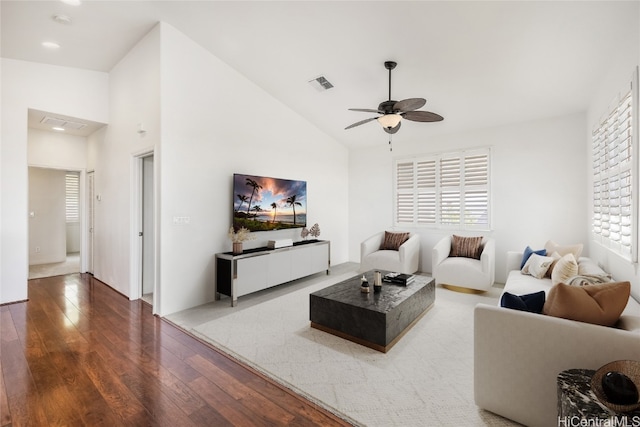 living room with hardwood / wood-style floors, ceiling fan, plenty of natural light, and high vaulted ceiling