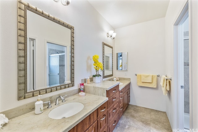 bathroom with walk in shower and vanity