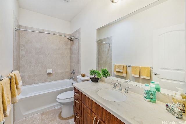 full bathroom featuring toilet, vanity, tiled shower / bath, and tile patterned floors