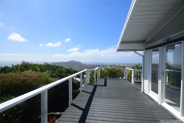 wooden deck with a mountain view