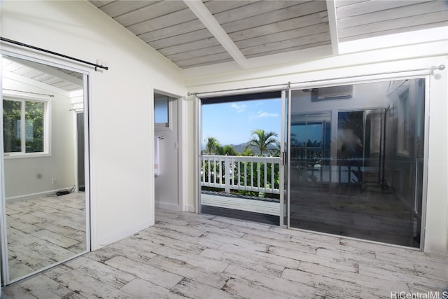 unfurnished sunroom with wooden ceiling and vaulted ceiling with beams