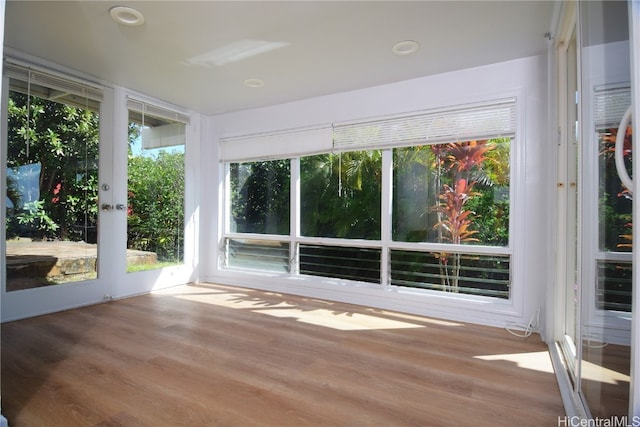 unfurnished sunroom featuring a healthy amount of sunlight