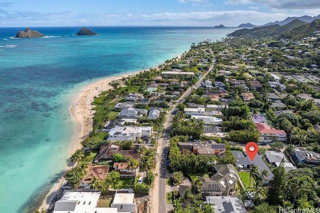 drone / aerial view with a view of the beach and a water and mountain view