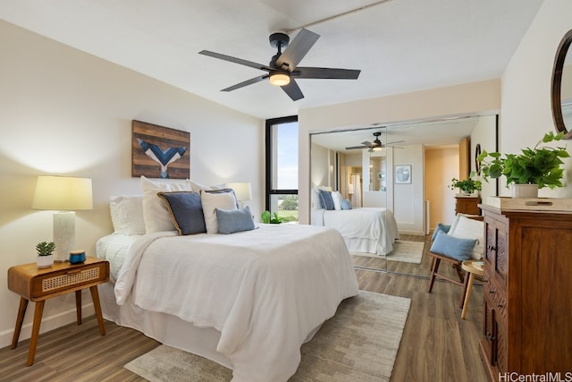 bedroom featuring hardwood / wood-style floors and ceiling fan