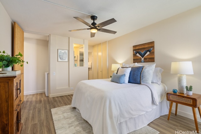 bedroom featuring hardwood / wood-style flooring and ceiling fan