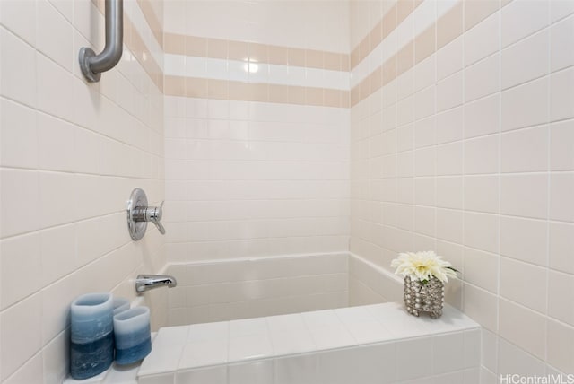 bathroom with tiled shower