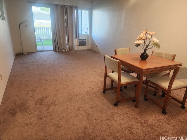 unfurnished dining area featuring cooling unit and light carpet