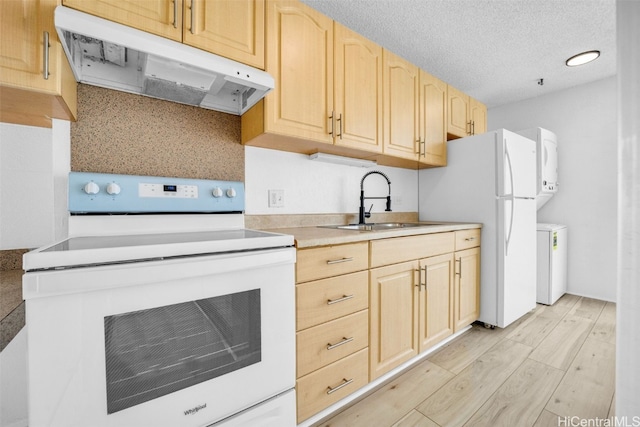 kitchen with light hardwood / wood-style flooring, light brown cabinetry, white appliances, and sink