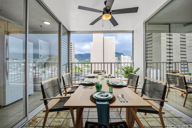 balcony featuring ceiling fan