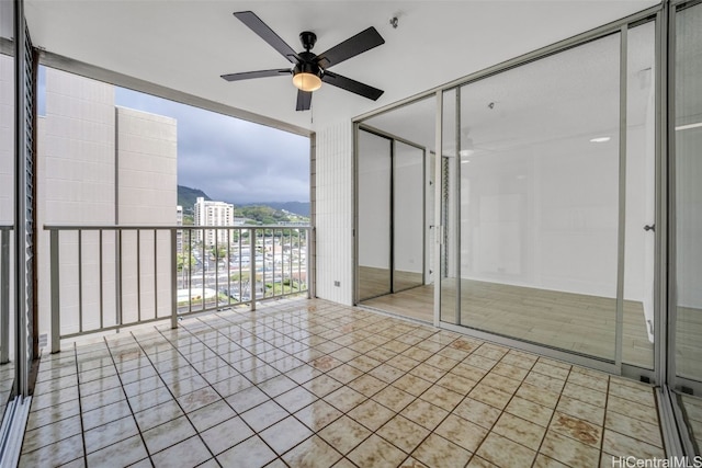 interior space featuring ceiling fan and a balcony