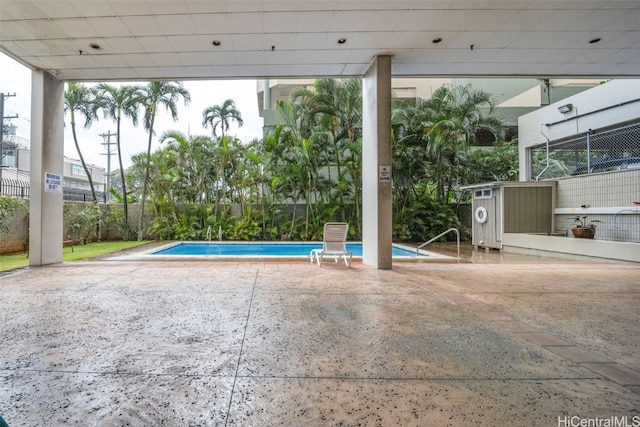 view of swimming pool with a patio area