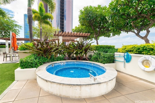 view of swimming pool with a patio area, a pergola, and an in ground hot tub