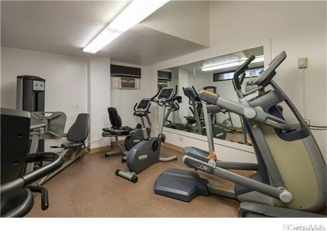 workout room with a wall mounted AC