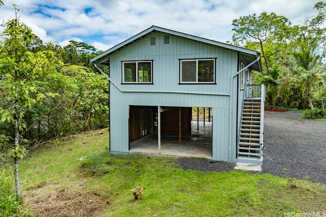 view of outbuilding with a yard