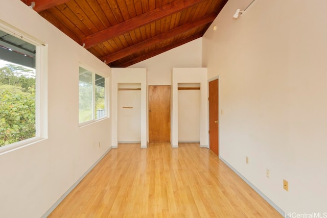 unfurnished bedroom featuring light hardwood / wood-style floors, wood ceiling, and lofted ceiling with beams