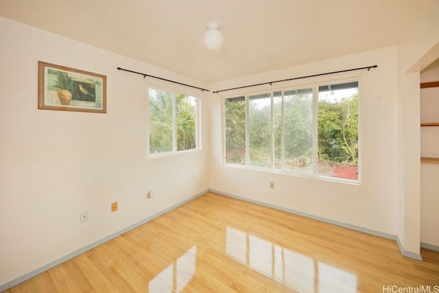 spare room featuring hardwood / wood-style floors