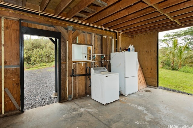 misc room featuring washer / clothes dryer and concrete floors