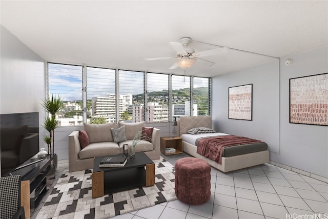 tiled bedroom with multiple windows and ceiling fan