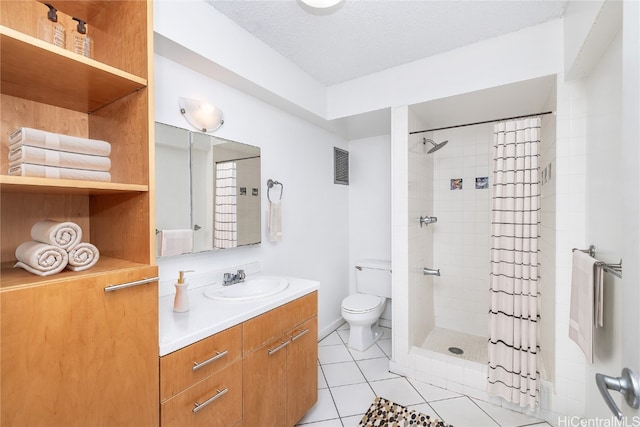 bathroom with a shower with shower curtain, a textured ceiling, vanity, tile patterned floors, and toilet