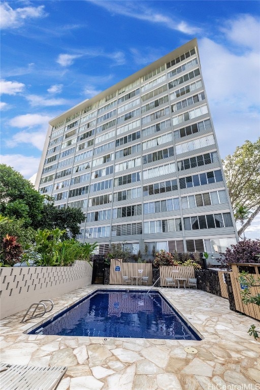 view of swimming pool featuring a patio area