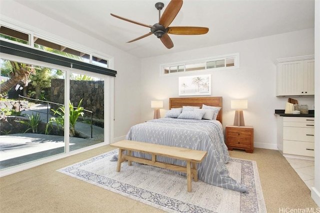 bedroom with ceiling fan, access to outside, and baseboards