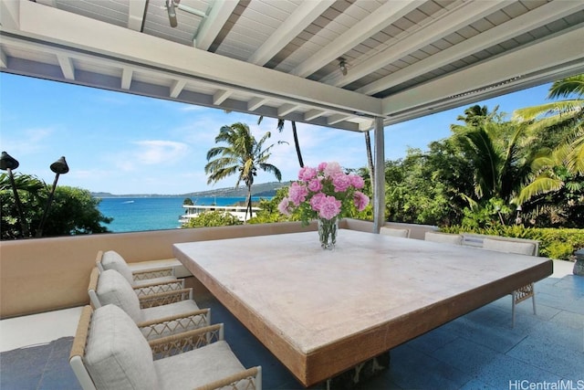 view of patio featuring a water view