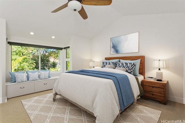 bedroom featuring light colored carpet, ceiling fan, and vaulted ceiling