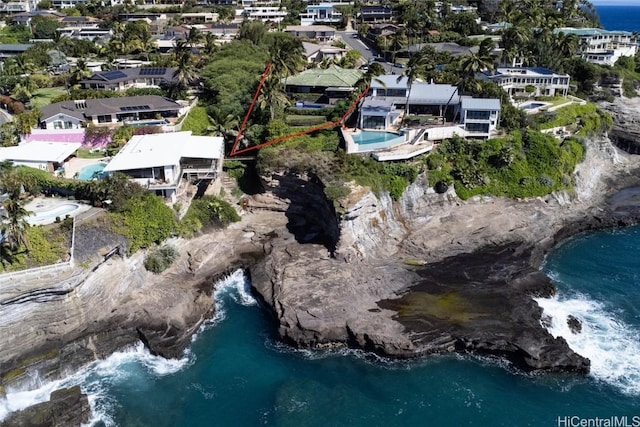 birds eye view of property featuring a water view