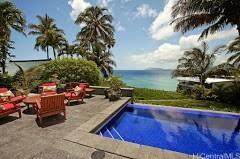 view of swimming pool with a water view and a patio area