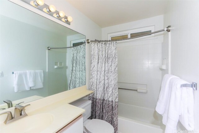 full bathroom featuring shower / bath combo, toilet, and vanity