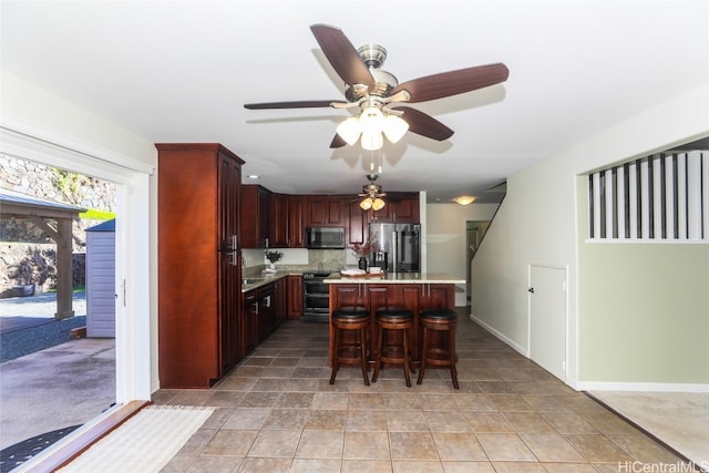 dining room featuring ceiling fan