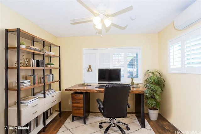 office space with a wealth of natural light, light hardwood / wood-style floors, a wall mounted AC, and ceiling fan