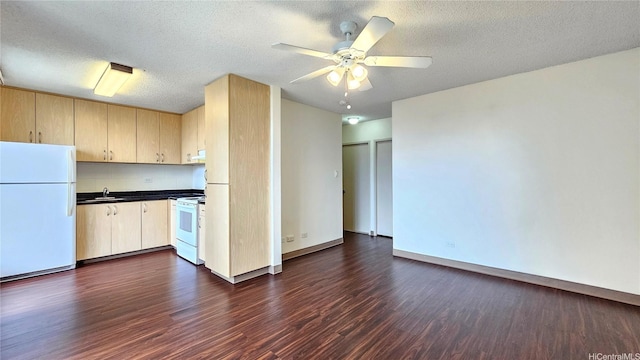 1655 Liholiho St, Honolulu, HI 96822 - kitchen featuring white appliances, dark wood-style floors, a sink, dark countertops, and light brown cabinets