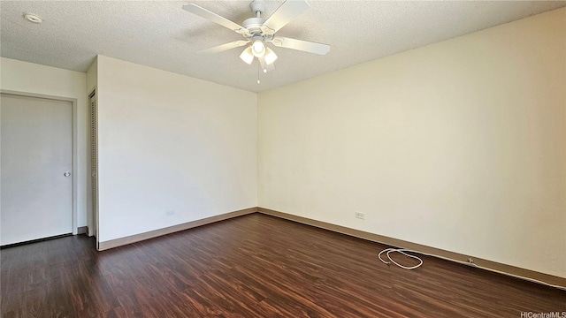 1655 Liholiho St, Honolulu, HI 96822 - empty room with dark wood-style flooring, a ceiling fan, a smoke detector, baseboards, and a textured ceiling