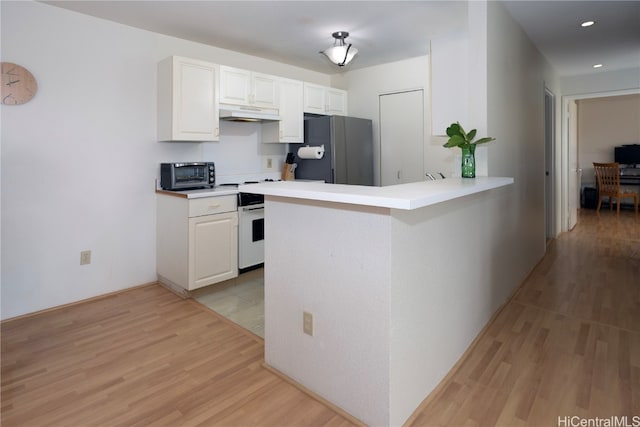 kitchen with white range with electric stovetop, stainless steel refrigerator, white cabinets, kitchen peninsula, and light hardwood / wood-style flooring