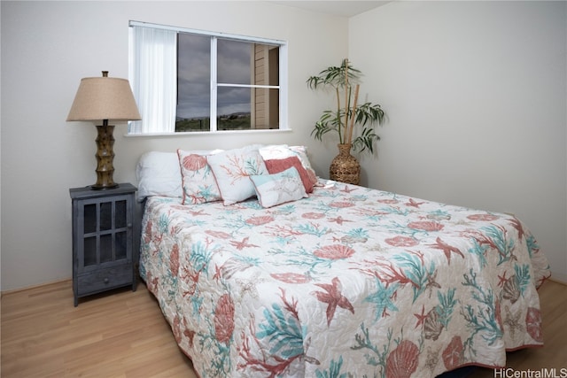 bedroom with light hardwood / wood-style floors