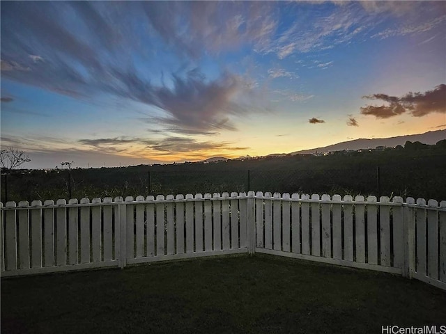 yard at dusk with a mountain view