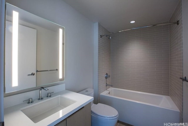 full bathroom featuring vanity, toilet, and tiled shower / bath combo