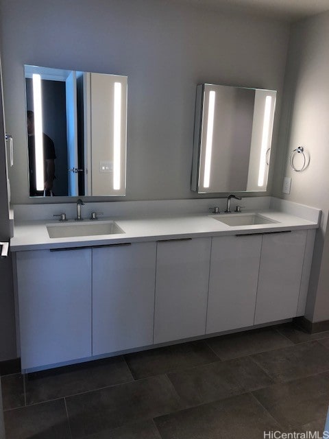 bathroom featuring tile patterned flooring and vanity