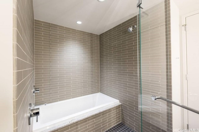 bathroom with a tile shower