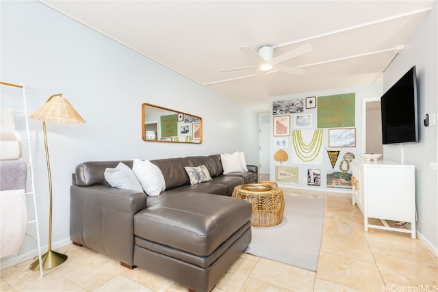 living room with ceiling fan and light tile patterned floors